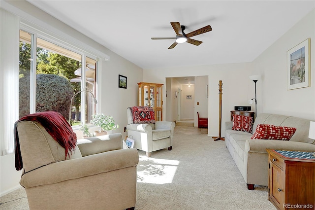 living room with ceiling fan and light carpet