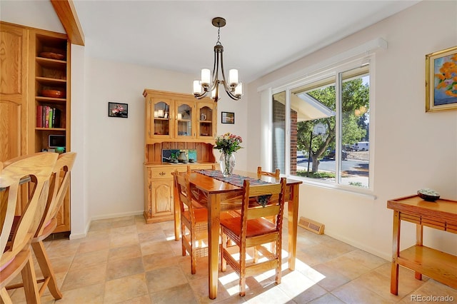 dining room featuring a chandelier