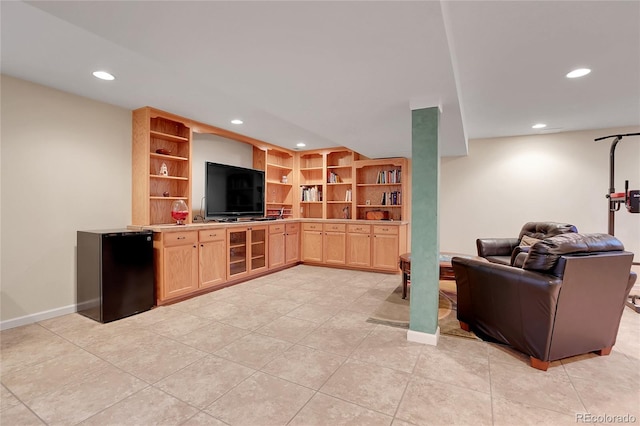 living room featuring built in shelves and wine cooler