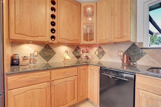 kitchen featuring dark stone countertops, decorative backsplash, and black dishwasher