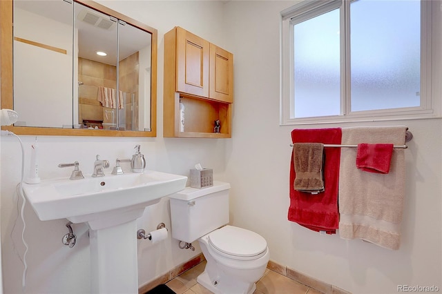 bathroom with tile patterned floors, toilet, and sink