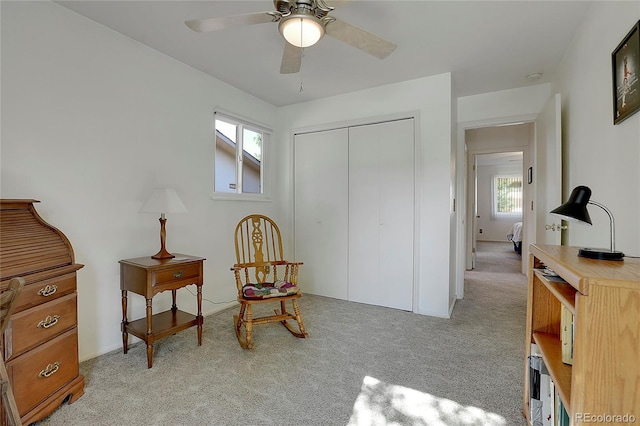 sitting room with light carpet and ceiling fan