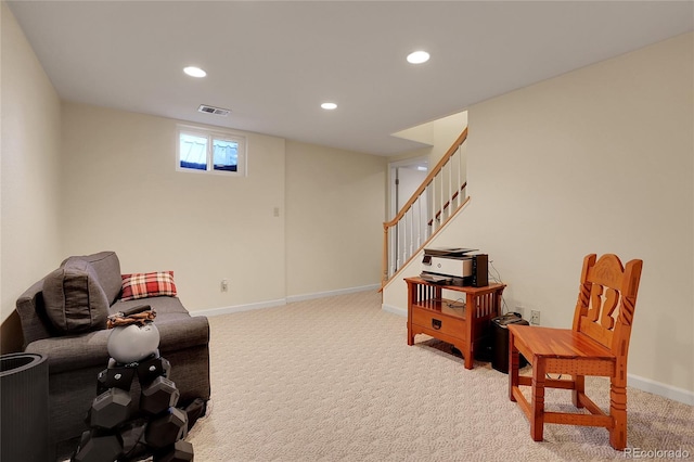 sitting room featuring carpet flooring