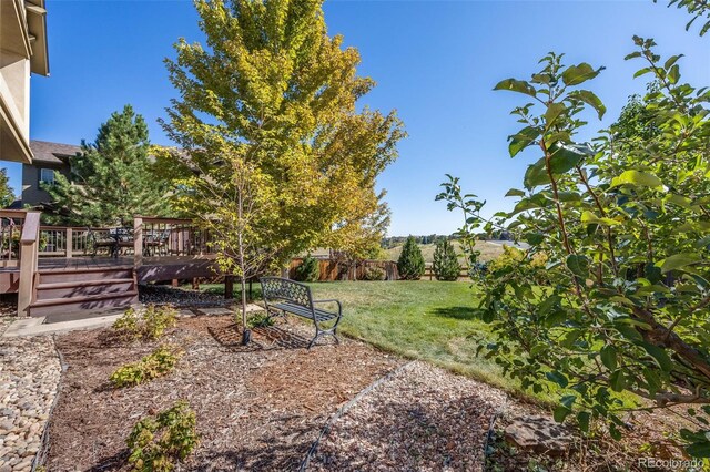 view of yard featuring a wooden deck