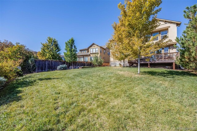 view of yard featuring a wooden deck