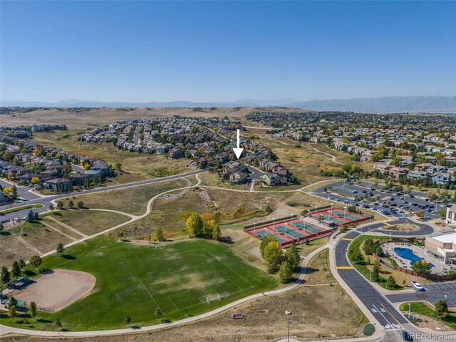 birds eye view of property featuring a mountain view