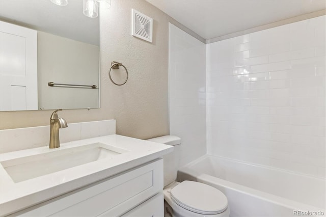 381 S Ames St Unit E104, Lakewood, CO 80226 - full bath with a textured wall, vanity, and shower / bathtub combination
