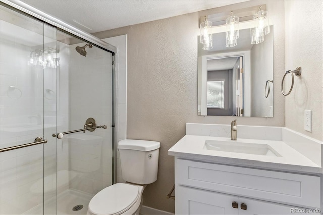 381 S Ames St Unit E104, Lakewood, CO 80226 - bathroom featuring vanity, a shower stall, and a textured wall