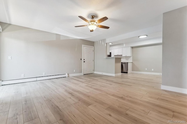 381 S Ames St Unit E104, Lakewood, CO 80226 - unfurnished living room featuring a baseboard heating unit, a ceiling fan, and light wood-style flooring