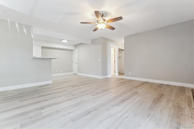 381 S Ames St Unit E104, Lakewood, CO 80226 - unfurnished living room featuring ceiling fan and light wood finished floors