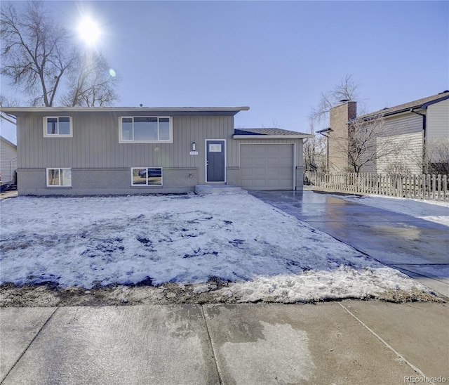 rear view of house with a garage