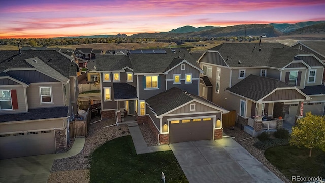 view of front of home featuring a mountain view and a garage