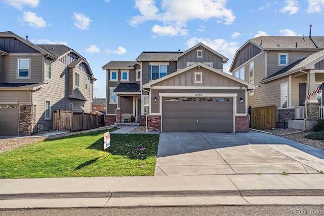 craftsman-style house with a front yard and a garage