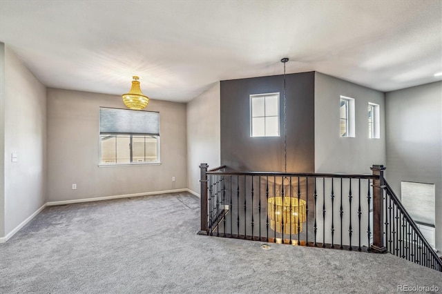 empty room featuring carpet and plenty of natural light