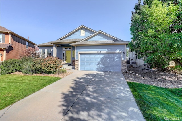 view of front facade with a front yard and a garage