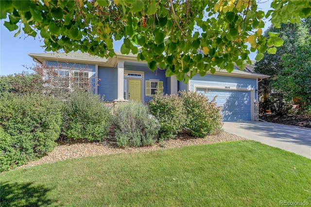 obstructed view of property featuring a front lawn and a garage