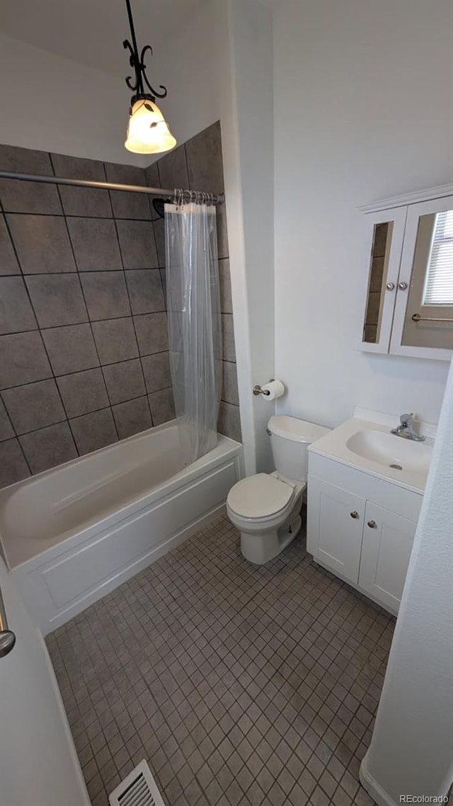 full bathroom featuring vanity, toilet, tile patterned flooring, and shower / bath combo