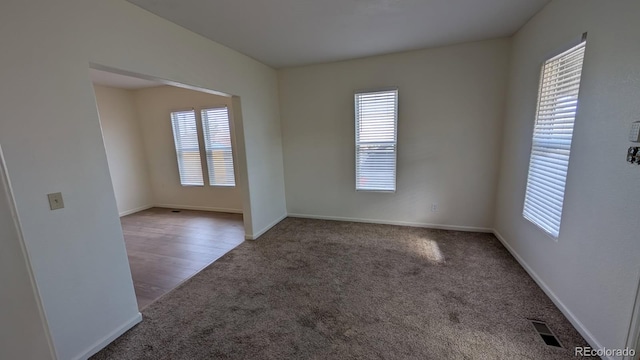 empty room featuring carpet flooring