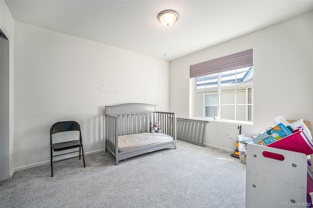 bedroom with carpet and baseboards