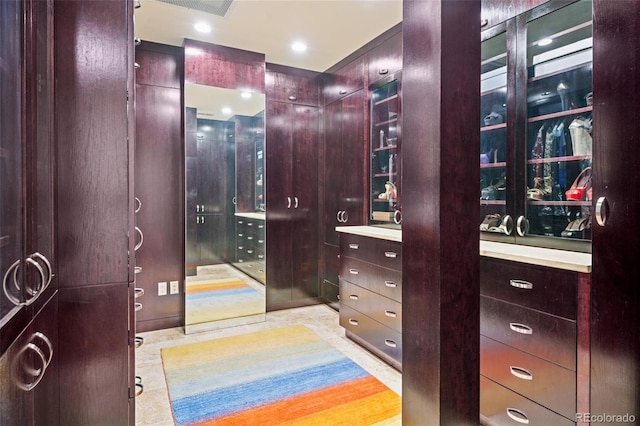 spacious closet featuring light tile patterned floors