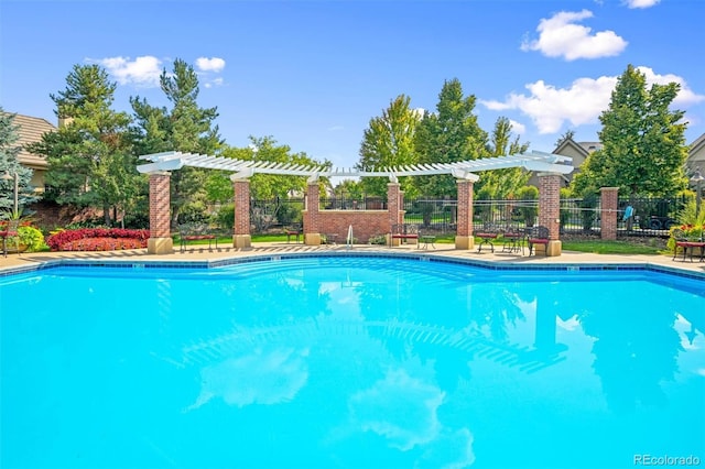 view of swimming pool with a pergola