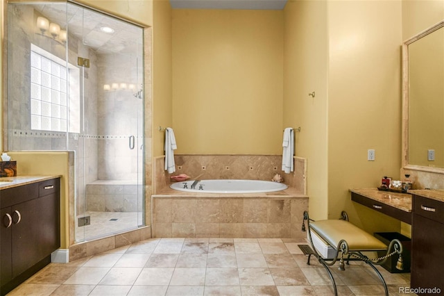 bathroom with independent shower and bath, vanity, and tile patterned floors