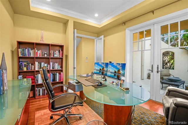 office with wood-type flooring, a raised ceiling, crown molding, and french doors