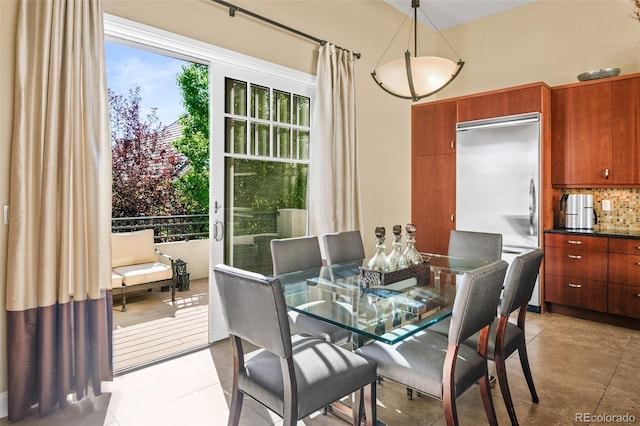 dining space featuring light tile patterned floors