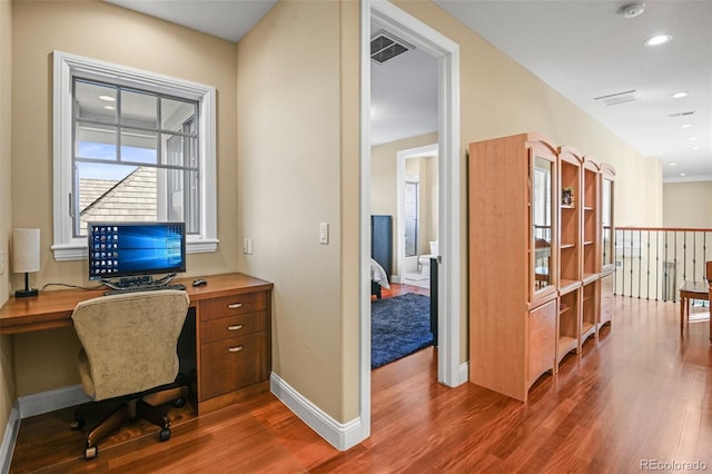 home office featuring recessed lighting, visible vents, dark wood finished floors, and baseboards