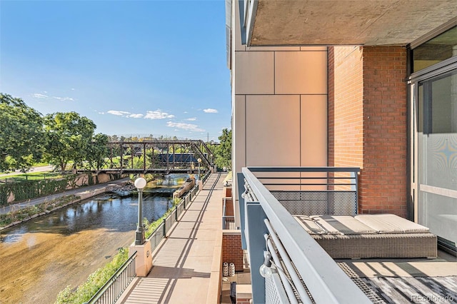 balcony featuring a water view