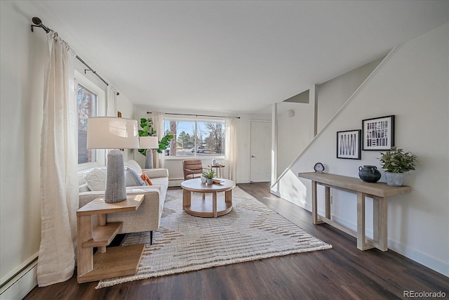 living room featuring a baseboard radiator and dark hardwood / wood-style flooring