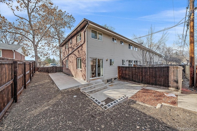 back of property featuring a patio area