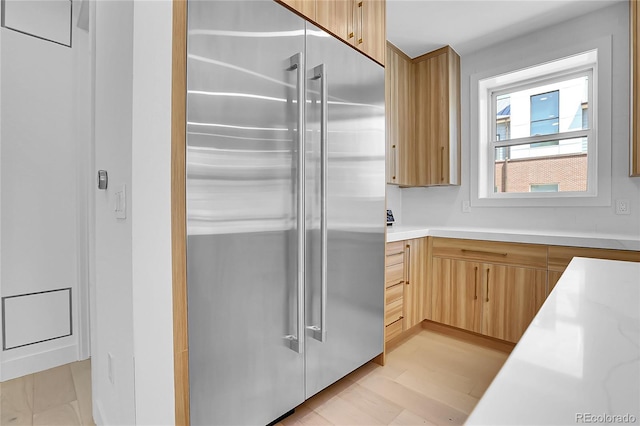 300 S Franklin St, Denver, CO 80209 - kitchen with high end fridge and light brown cabinets