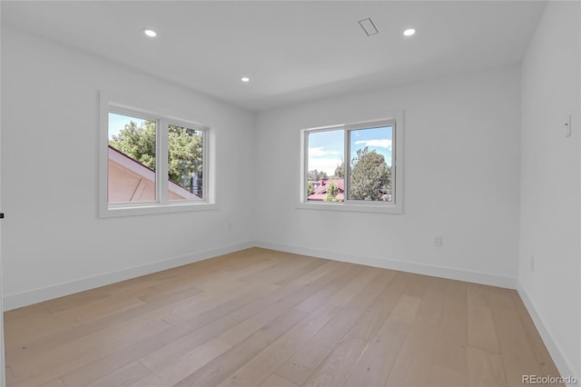 300 S Franklin St, Denver, CO 80209 - empty room featuring plenty of natural light, light wood-style flooring, and recessed lighting