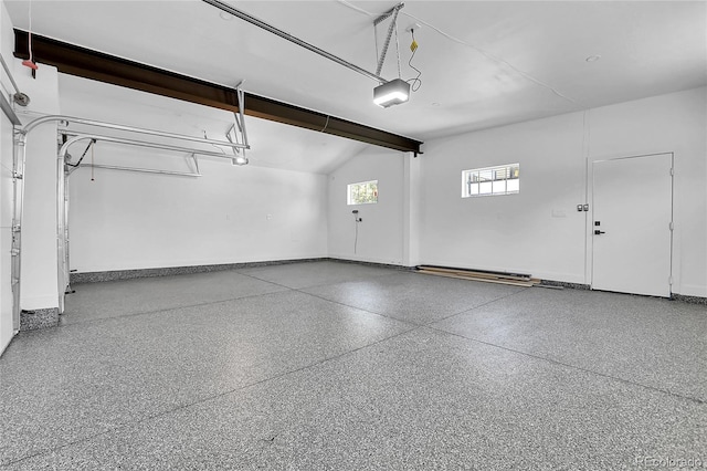 300 S Franklin St, Denver, CO 80209 - garage featuring baseboards and a garage door opener