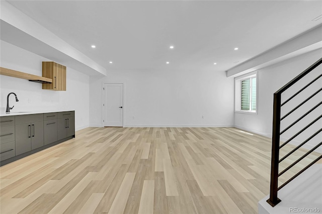 300 S Franklin St, Denver, CO 80209 - unfurnished living room featuring stairs, light wood-style flooring, and recessed lighting