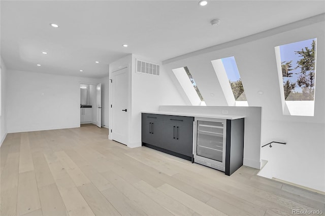 300 S Franklin St, Denver, CO 80209 - bar with beverage cooler, a skylight, recessed lighting, and light wood-style floors