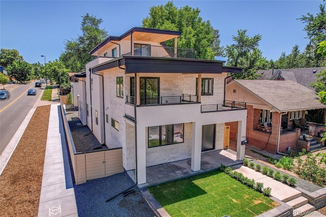 300 S Franklin St, Denver, CO 80209 - rear view of property with a balcony, stucco siding, and a patio