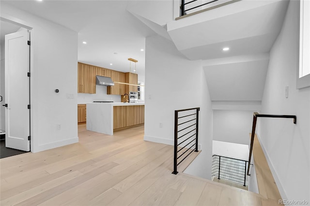 300 S Franklin St, Denver, CO 80209 - staircase with wood finished floors and recessed lighting