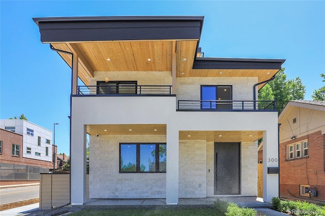 300 S Franklin St, Denver, CO 80209 - modern home with a balcony and stone siding