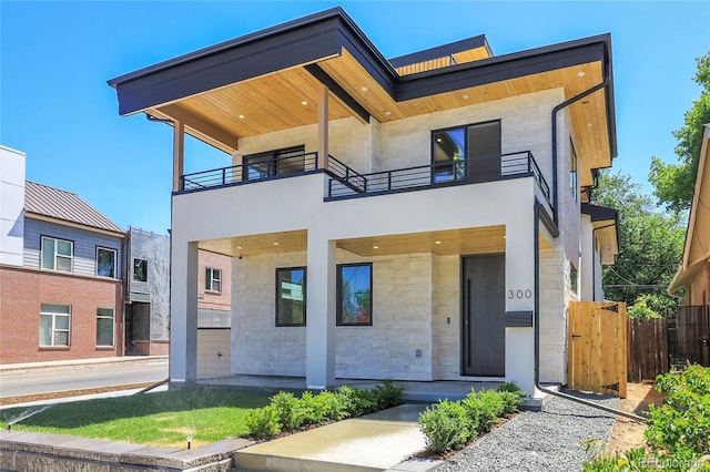 300 S Franklin St, Denver, CO 80209 - contemporary home featuring a balcony and stone siding