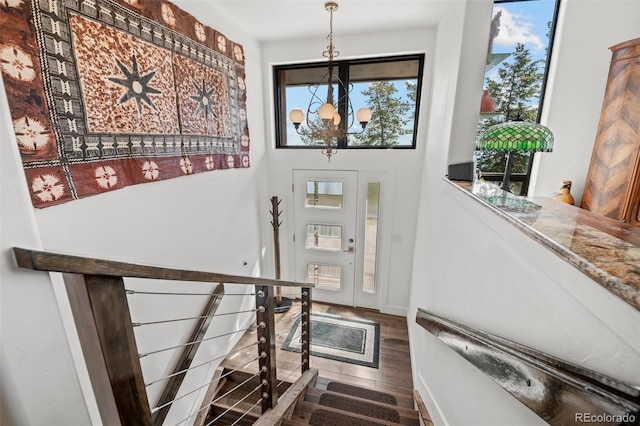 8453 S Scenic Dr, Morrison, CO 80465 - foyer entrance with a chandelier, wood finished floors, and baseboards