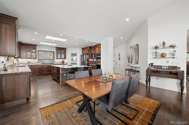 8453 S Scenic Dr, Morrison, CO 80465 - dining space featuring dark wood finished floors, recessed lighting, and vaulted ceiling