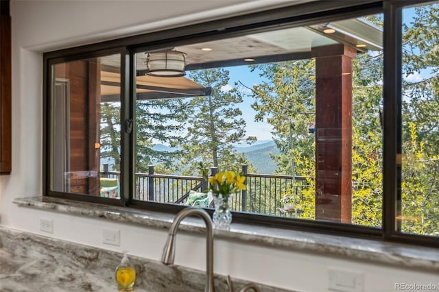 8453 S Scenic Dr, Morrison, CO 80465 - kitchen view of a mountainous background and stone counters