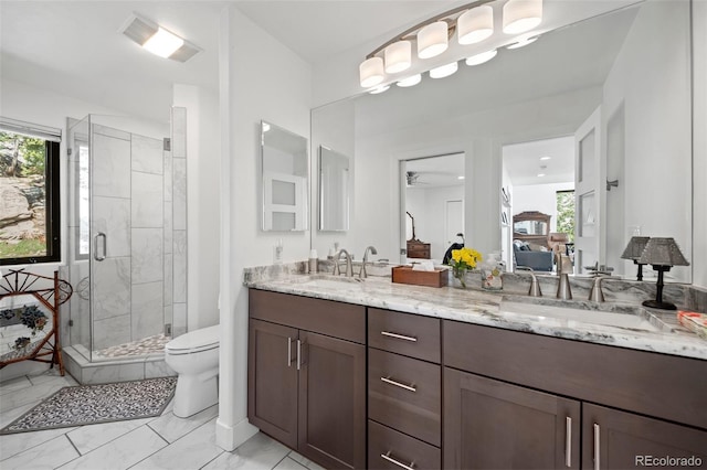 8453 S Scenic Dr, Morrison, CO 80465 - full bath featuring ensuite bath, a stall shower, a ceiling fan, toilet, and double vanity