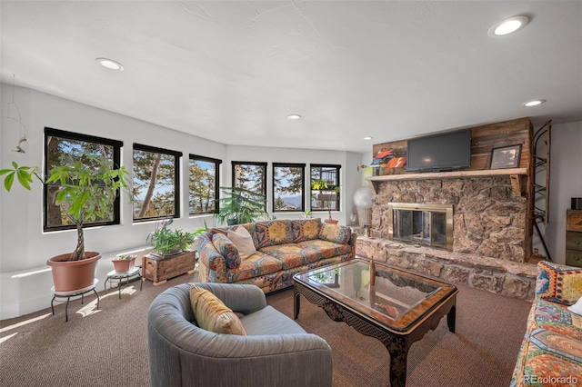 8453 S Scenic Dr, Morrison, CO 80465 - carpeted living area with a stone fireplace, recessed lighting, and baseboards