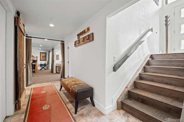 8453 S Scenic Dr, Morrison, CO 80465 - stairway featuring a barn door, recessed lighting, and baseboards