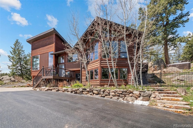 8453 S Scenic Dr, Morrison, CO 80465 - view of front facade with stairs and a wooden deck