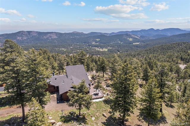 8453 S Scenic Dr, Morrison, CO 80465 - view from above of property with a heavily wooded area and a mountainous background