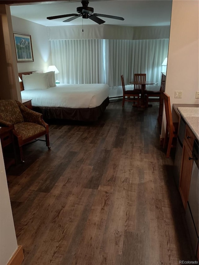 bedroom featuring dark wood-type flooring and ceiling fan